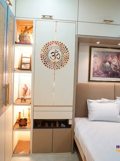 This design shows how a mandir can be elegantly incorporated into a bedroom wardrobe. I used a beautiful "Om" mandala on the cabinet door, which opens to a dedicated, warmly lit niche for prayer. This solution provides a personal spiritual corner without requiring a separate room.