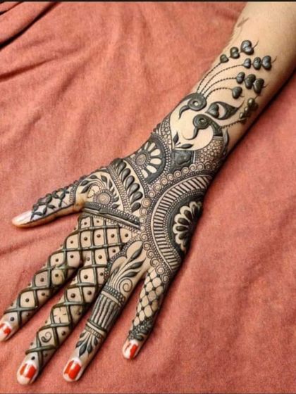 A stylish and modern Arabic design for the back of the hand, featuring a peacock and geometric patterns.