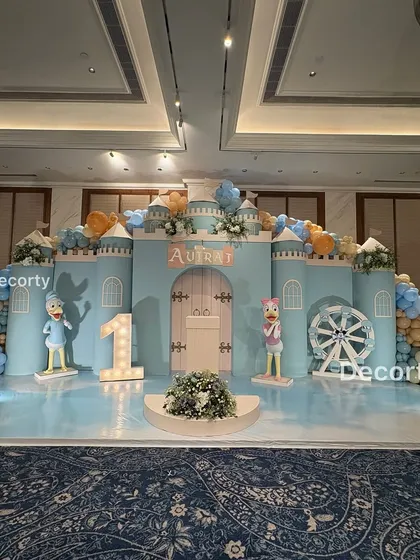 A full-scale Disneyland castle stage I designed for a magical first birthday. This grand backdrop features character cutouts, a light-up number one, and a sky-blue floor to transport guests to a fairytale land.