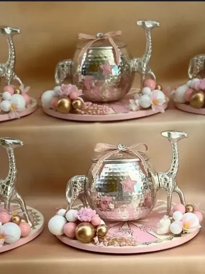 These unique silver-plated camel and elephant-shaped candy dishes are a whimsical and charming addition to any festive decor. They are perfect for serving small treats to guests.