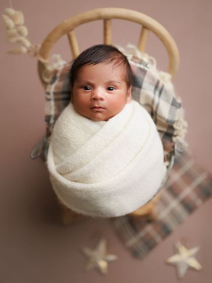 Caught this little cutie with eyes wide open. It's always a special treat to capture their beautiful, curious gaze during a session.