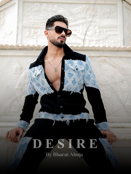 This image highlights the blend of rugged rawness and tailored sophistication in the denim patchwork suit. It's a statement of power and individuality.