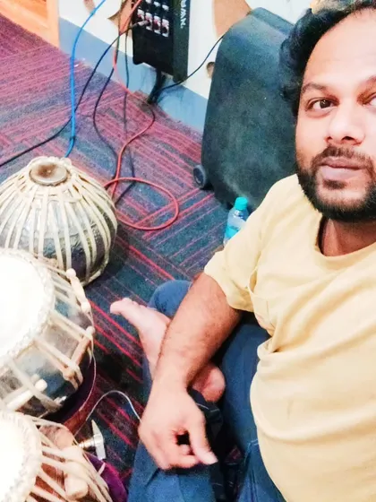 A moment of rest between takes during a long recording session. I am always ready with my instruments to give my best for the track.