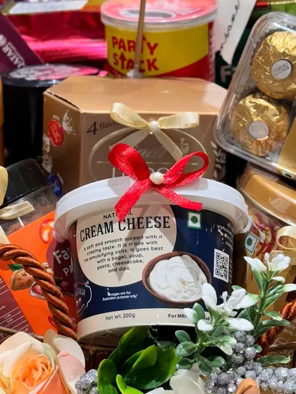 Quality ingredients are key. This hamper includes natural cream cheese and other gourmet items, curated to offer a sophisticated taste profile for discerning clients.