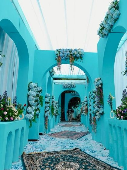 Another perspective of the stunning blue archway entrance, showcasing the depth and immersive experience created for guests as they arrive.