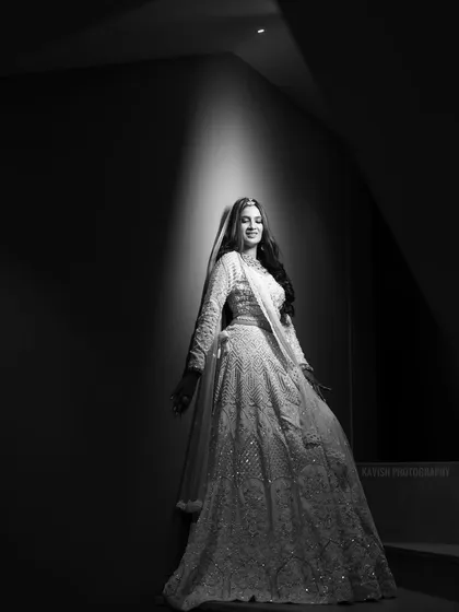 Another powerful black and white shot on the stairs, focusing on the bride's form and the play of light and shadow.