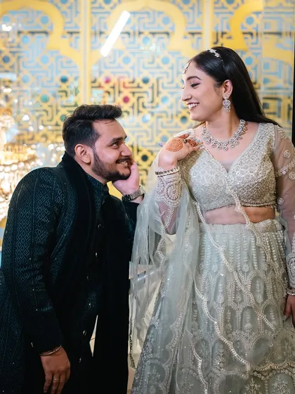 A groom's adoring gaze at his bride. This candid moment from their engagement is full of love and admiration.