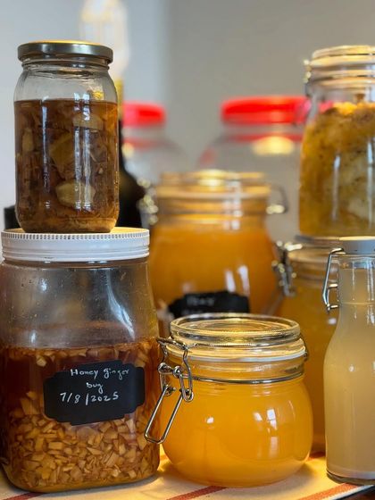 A close-up of our fermentation station, showing a honey-ginger bug dated for 2025. This shows the patience and time that goes into crafting each of our natural drinks.