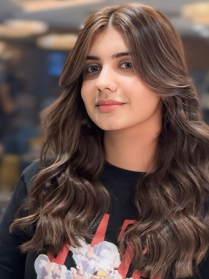 Another angle of this trending ash brown color. The subtle highlights and lowlights within the brown base create a multi-dimensional effect that looks both natural and sophisticated.