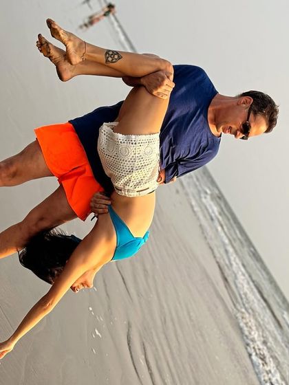 A playful moment of acro yoga on the beach with my husband. Trust and communication are key, both in partner yoga and in life.