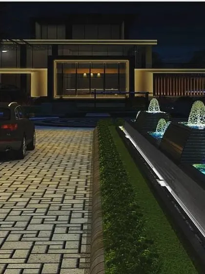 A lighting concept for the Silver Oak City clubhouse, designed by ADCPL Delhi. The visualization includes the building's facade, the driveway approach, and landscape elements like the illuminated water fountains, showing a holistic design approach.