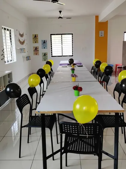 The studio is a blank canvas for your party! Here it is set up with black and yellow balloons for a fun celebration.