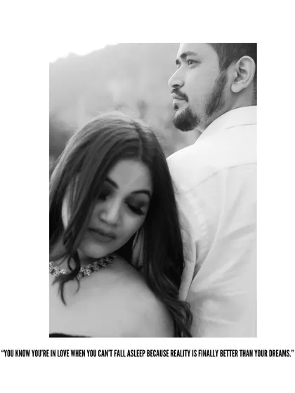 A close-up black and white portrait from the sunset shoot. The focus on the bride's serene expression as she leans on her partner creates a feeling of peace and deep connection.
