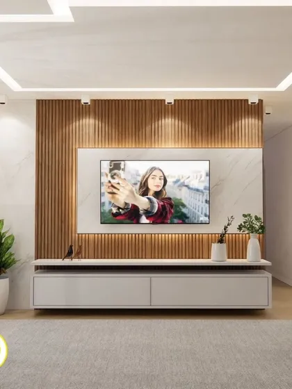 A modern TV unit with a white console and a backdrop of marble and wood fluting. The design is clean, contemporary, and provides ample storage.