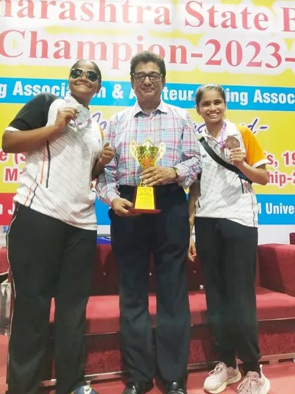 I stand with my state-level medalists, Parijat Rokade (Silver) and Bhumi Meher (Bronze), at the Maharashtra State Junior Girls Boxing Championships. Two fighters, two medals for the club.