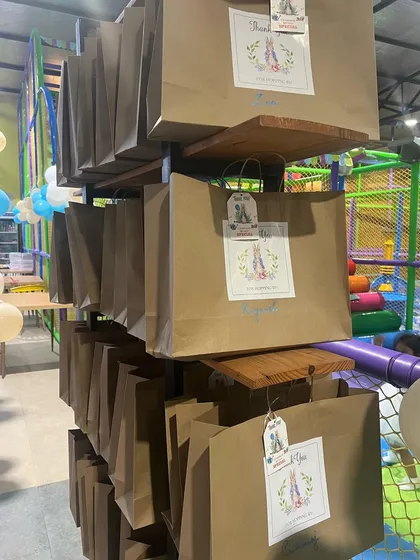 Custom return gift bags ready for a Peter Rabbit themed first birthday party.
