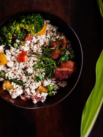 A close-up of my special keema meal, made with finely minced chicken, vibrant vegetables like bell peppers and peas, and topped with fresh dill. This is one of my most popular dishes, loved for its texture and flavor.