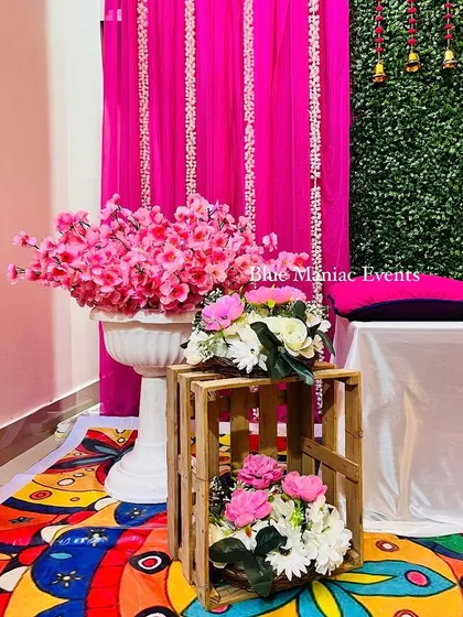 A close-up of the decor details, including the rustic wooden crates used as stands for the floral arrangements.