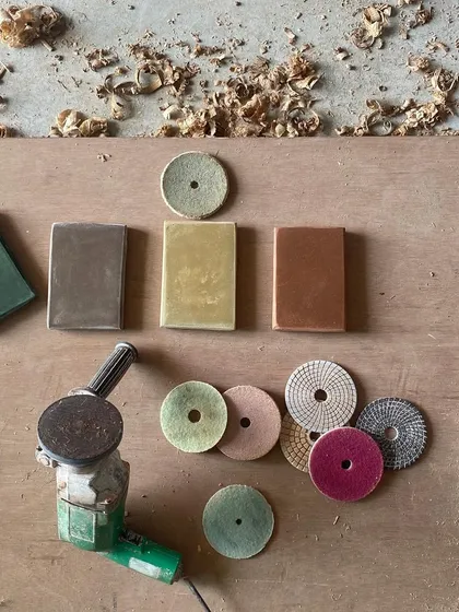 A behind-the-scenes look at our material exploration for the 'Organic Square' project. We experiment with polishing different types of Indian stones to achieve the perfect color and finish, a testament to our hands-on, collaborative process.
