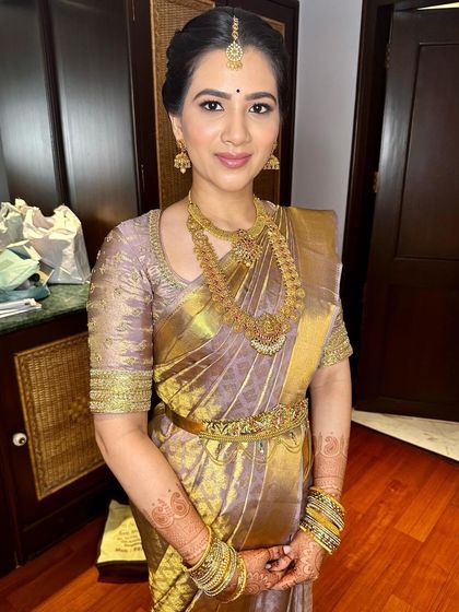 The complete engagement look. Her timeless makeup pairs perfectly with the classic silk saree and gold jewelry, creating a sophisticated and memorable style.