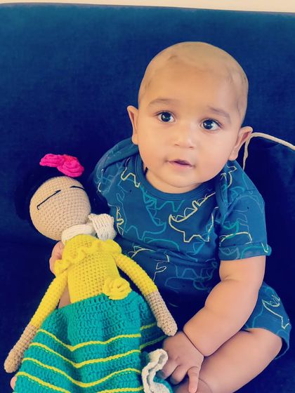 This picture is a great reminder to let toys be toys. Boys love dolls too, and this little one is enjoying his new Frida doll companion.