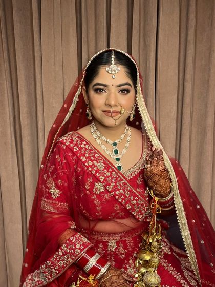 The complete bridal look for Jaya. The makeup is balanced to perfection, from the bindi to the soft-focus eyes.