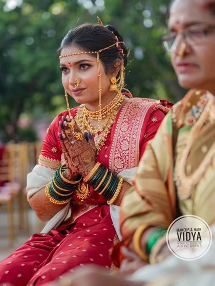 A moment of prayer during the wedding ceremony. Priya's traditional attire, including the mundavalya, is beautifully showcased here.