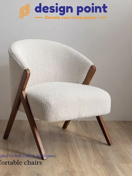 A comfortable and elegant accent chair with a solid wood frame and textured white fabric. Its clean lines make it a versatile addition to any room.