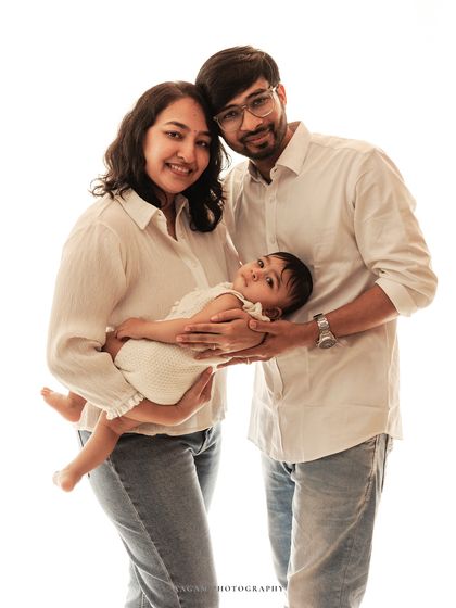 Memories in the making. This family chose a clean, high-key look with white shirts and jeans for a fresh and modern family portrait.