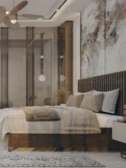 The bed in this room features a fluted wooden headboard set against a dramatic, textured marble-effect wall.