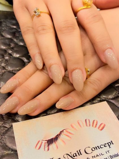 A simple and chic set of almond-shaped nails in a solid nude color. This versatile look is perfect for any occasion and complements any outfit.