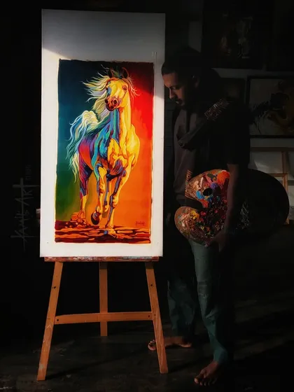 This is me in my studio with a finished piece that captures the raw energy I love to paint. This colorful horse, rendered in my signature expressive style with acrylics, shows the movement and power that is a hallmark of my animal portraits.