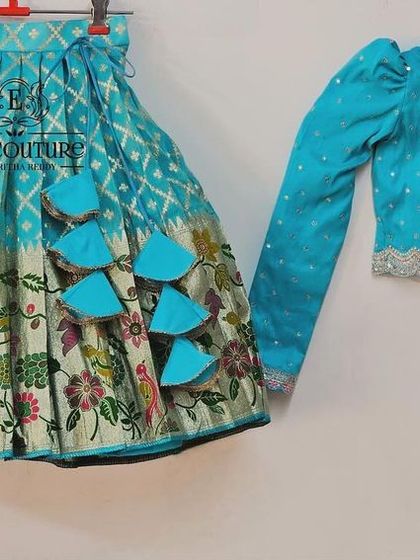 A beautiful long-sleeved blouse and lehenga set. This can be paired with a matching outfit for a mother or sister.
