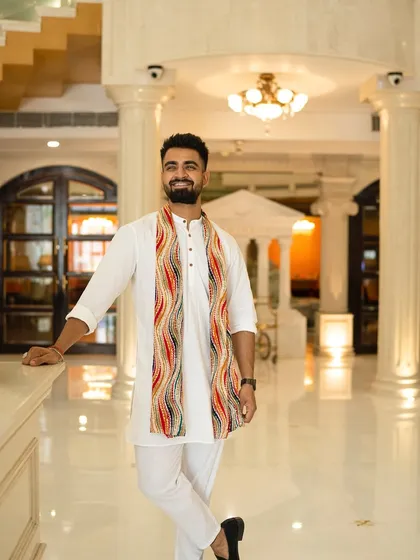 Standing tall in a grand hotel lobby. The environment inspires my performance.