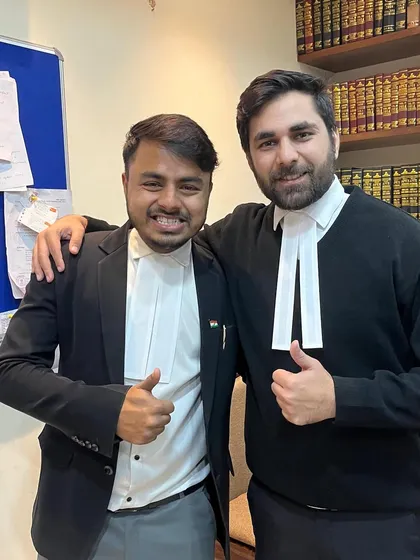 A good day in court. My colleague and I after a successful hearing. We're not just a team, we're partners in fighting for our clients' rights.