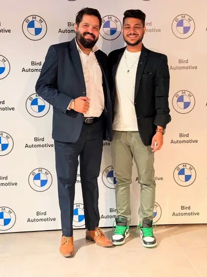 A photo with a key organizer at the BMW Bird Automotive show. Building strong relationships with clients and event planners is crucial, and I'm grateful for their repeated trust.