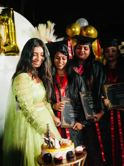 Sharing a happy moment with my students during the graduation cake cutting ceremony.