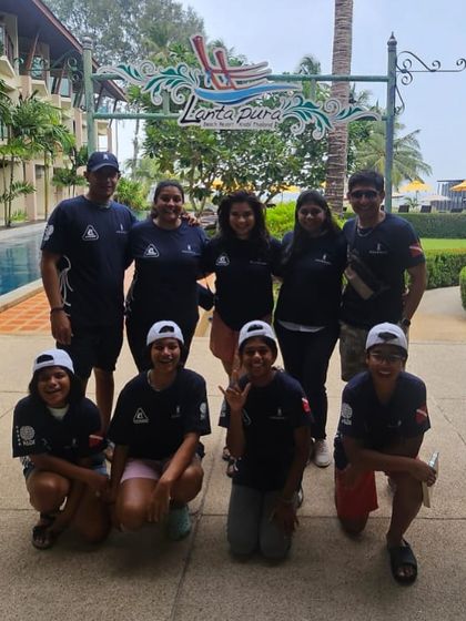 The whole team, young and old, after a successful PADI certification course in Koh Lanta, Thailand. It's a proud moment for everyone.