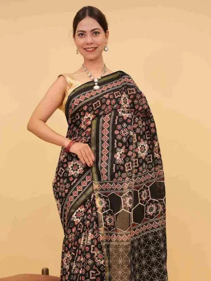 This black ready-to-wear saree features a complex geometric print, offering a contemporary take on traditional attire. It’s a testament to how versatile the 1-minute saree can be.