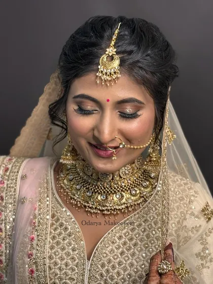 Eyes closed, showcasing the beautiful soft glam eye makeup. The blend of neutral shimmers creates a look that is both elegant and captivating.