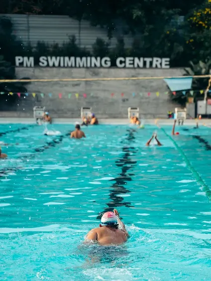 Our training isn't just for kids. Here, an adult swimmer practices their form in one of our dedicated lanes. We offer a supportive, judgment-free environment for adults to learn, improve their strokes, and build water confidence.