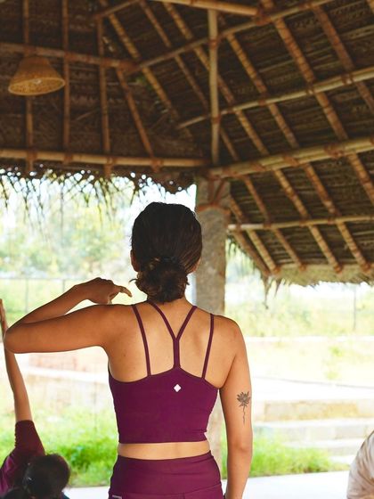 A view from the back of the class during a retreat, showing me guiding students. My focus is on creating a safe and inclusive space for everyone to connect with their prana, or life force energy.