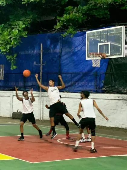 Players battle for a rebound in the air. We train our athletes to be aggressive and fight for every possession.