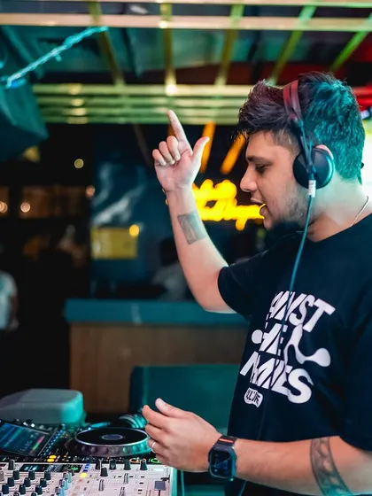 In the zone, cueing up the next track to keep the party going.