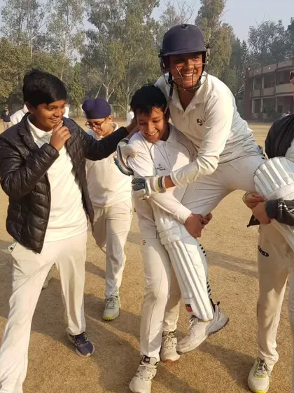 The joy of a teammate's success. Here the boys celebrate Rytham's magnificent match-winning innings. This camaraderie is the heart of our academy.