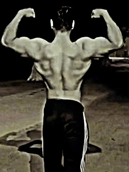 Developing a wide, detailed back is crucial for a powerful physique. This back double biceps pose showcases the development of the lats, traps, and lower back muscles. My programs focus on building both thickness and width for a dominant stage presence.