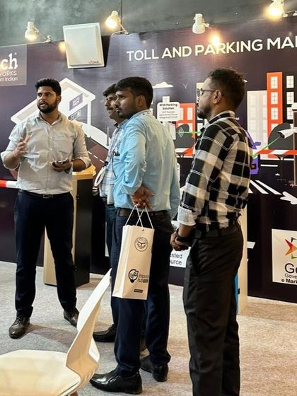 A team member presenting our toll and parking management solutions to visitors at the UP International Trade Show.