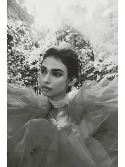 The same shot from 'Roots' in black and white. Removing the color allows the focus to shift entirely to the texture of the tulle and the model's strong expression.