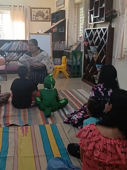 A wider view of the monster story session, showing the relaxed and comfortable atmosphere.