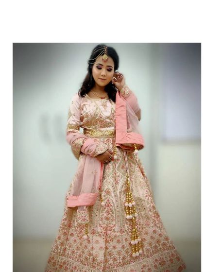 Learning to pose clients for portfolio shots is also part of our training, as seen in this elegant full-length photo of a student's bridal creation.